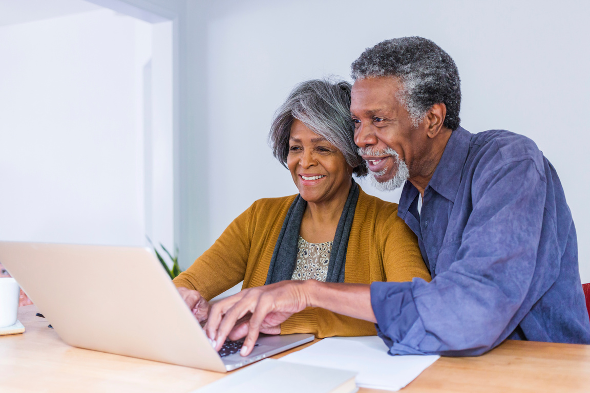 Senior African American Couple Doing Home Finances on Computer
